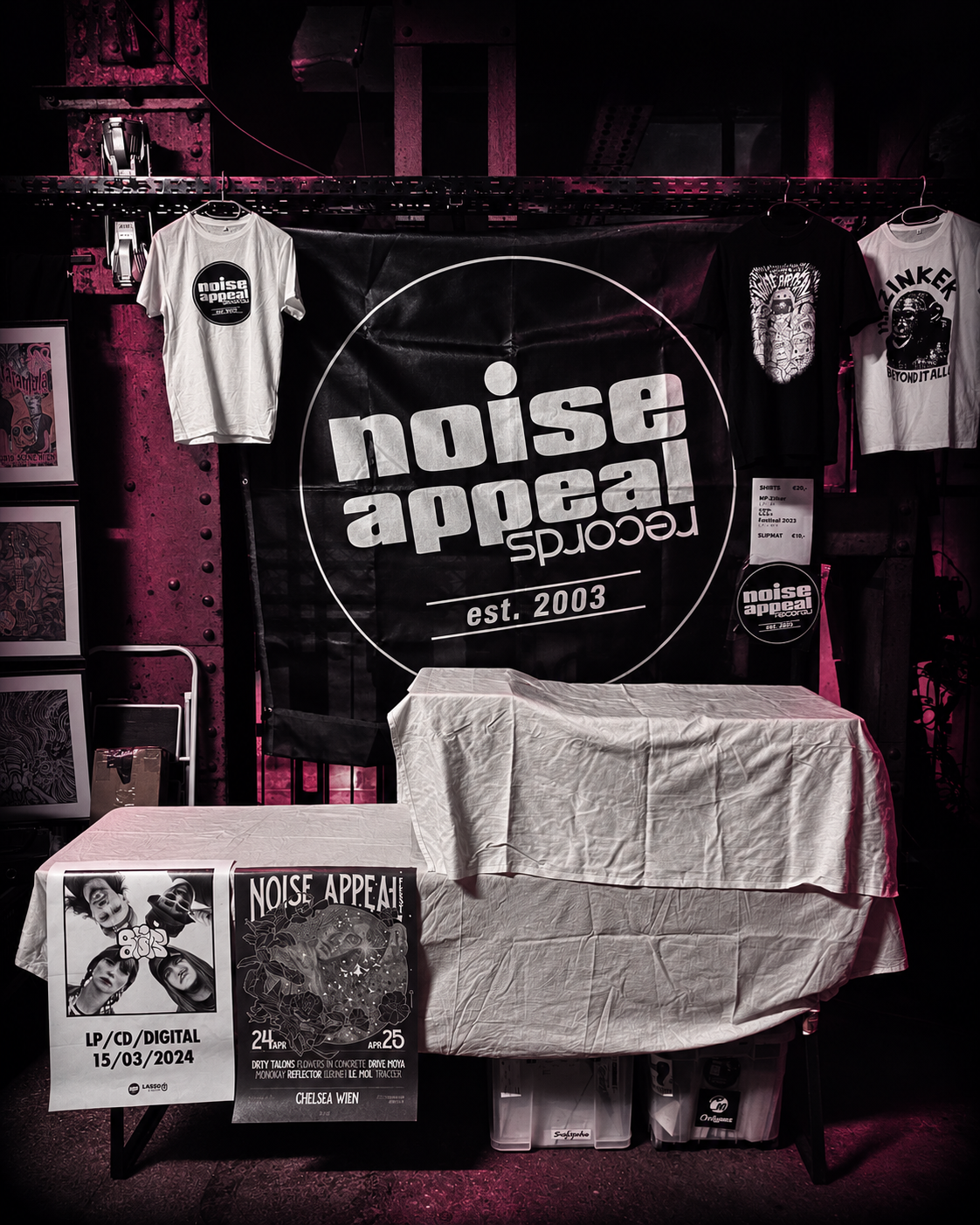 Noise Appeal stall with records, T-shirts and a label banner