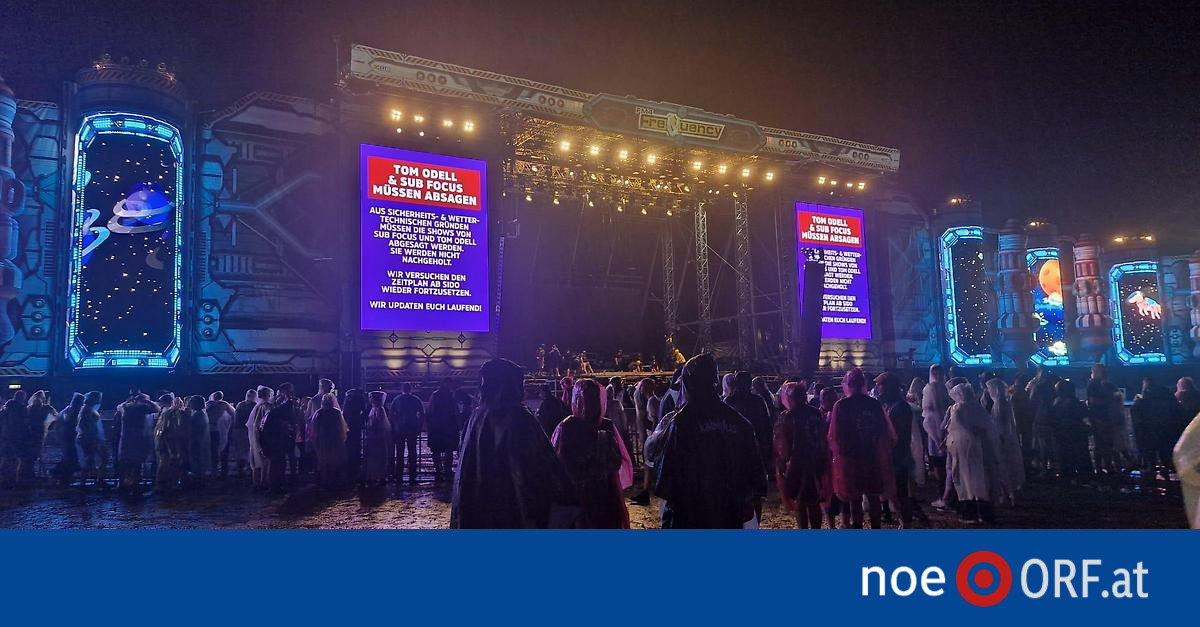 Festival crowd leaving the Frequency performance area during the Friday weather shutdown